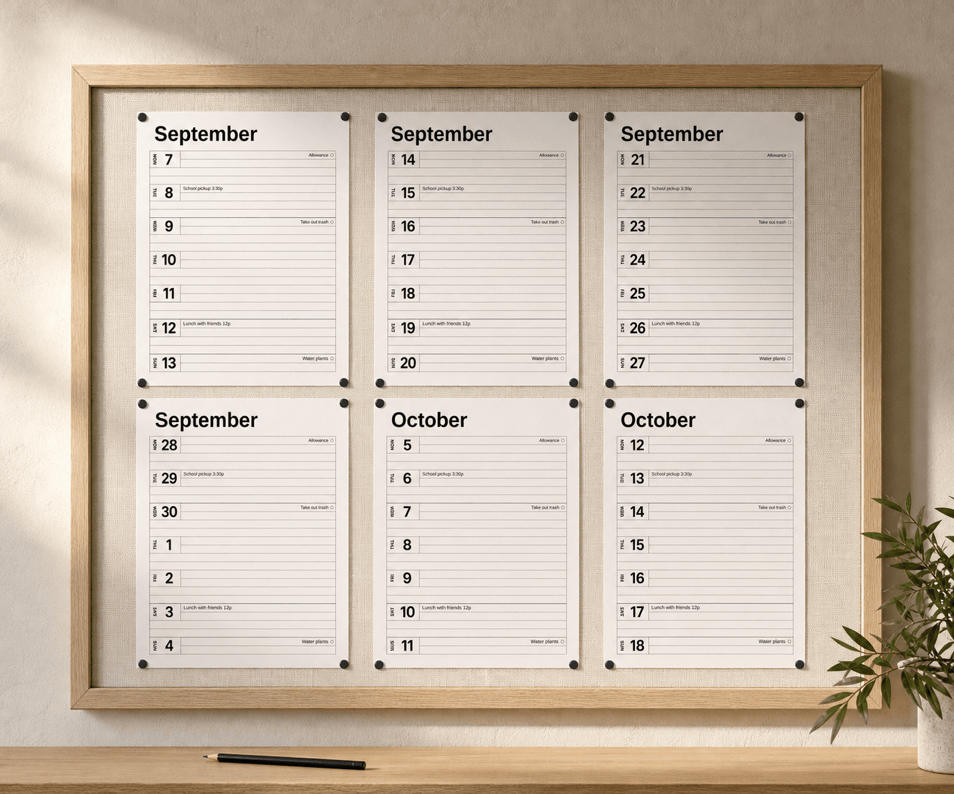 Six weekly planner pages arranged in two rows of three on an oak-framed magnetic bulletin board, held by small black magnets.